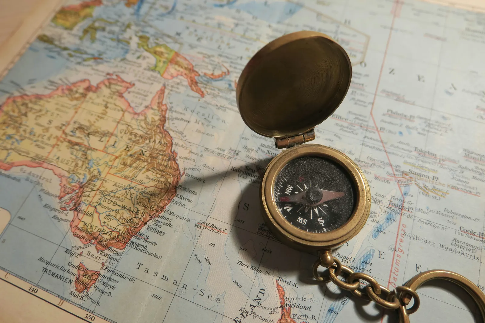 Nautical chart with a brass compass
